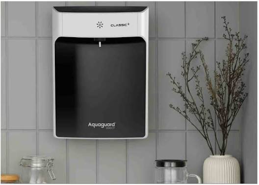 Modern RO water purifier installed in a home kitchen